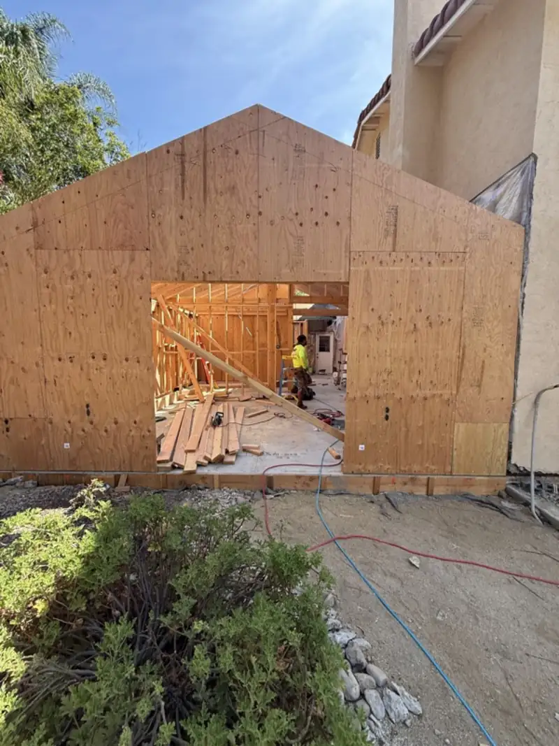 Sheathed gable end of a new addition