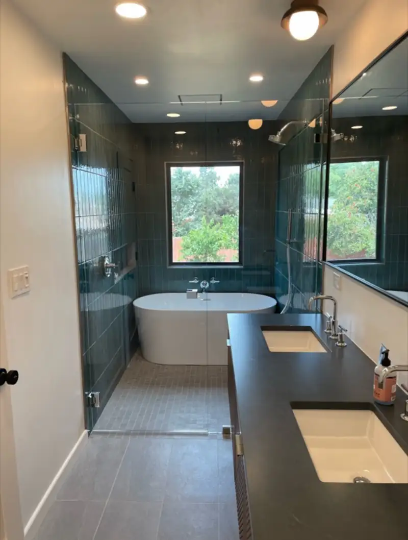 Bathroom with a freestanding tub and walk-in glass shower